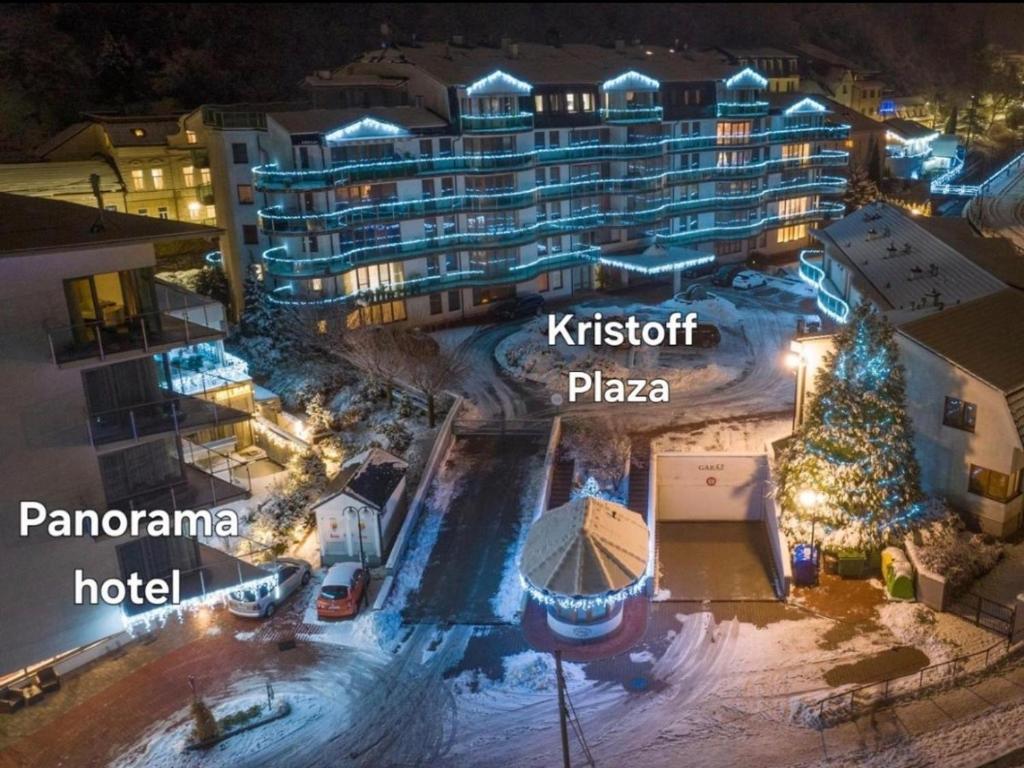 una vista aérea de un hotel por la noche en Plazza Trencianske Teplice Spa Panorama 4P, en Trenčín