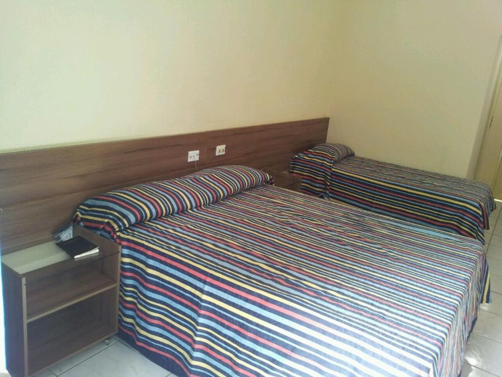 Postel nebo postele na pokoji v ubytování Fiesta Park Hotel