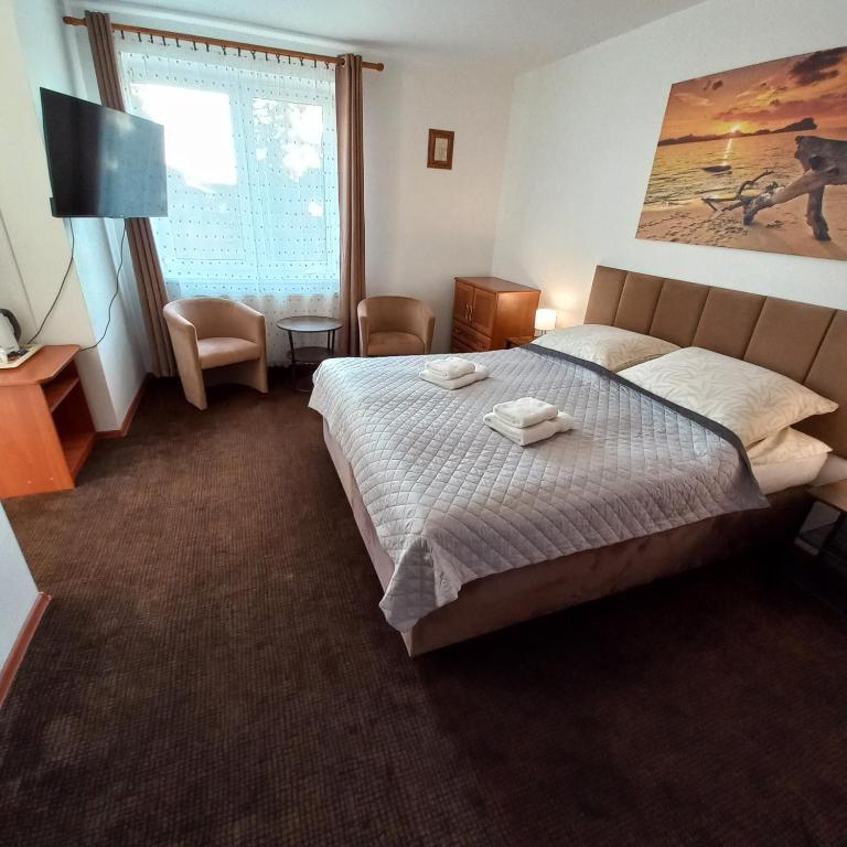 Postel nebo postele na pokoji v ubytování Akwen
