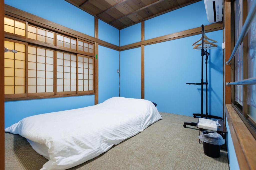 Postel nebo postele na pokoji v ubytování Guesthouse Fukufuku