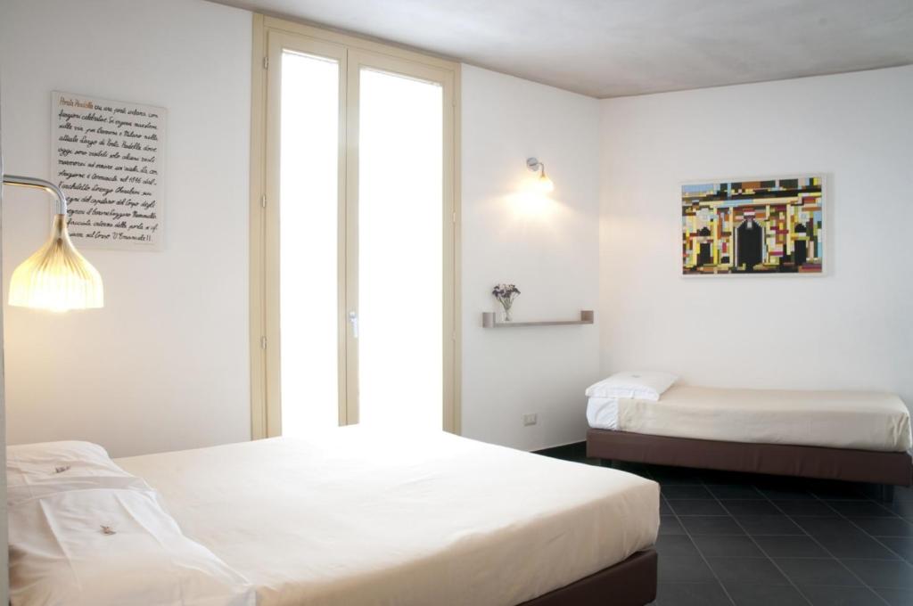 Postel nebo postele na pokoji v ubytování 6 Porte Guesthouse