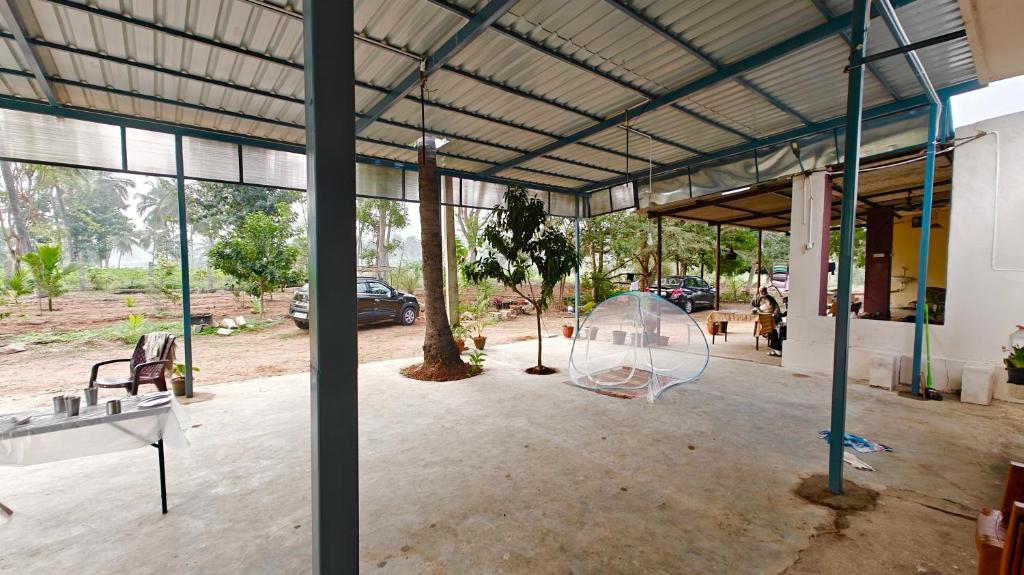 a large building with a glass sculpture in the middle at Oasis Farm Stay in Bengaluru