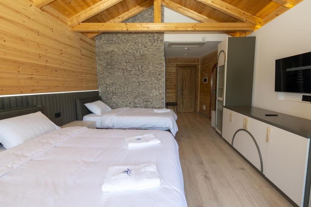 Postel nebo postele na pokoji v ubytování Hotel 5 Stinet