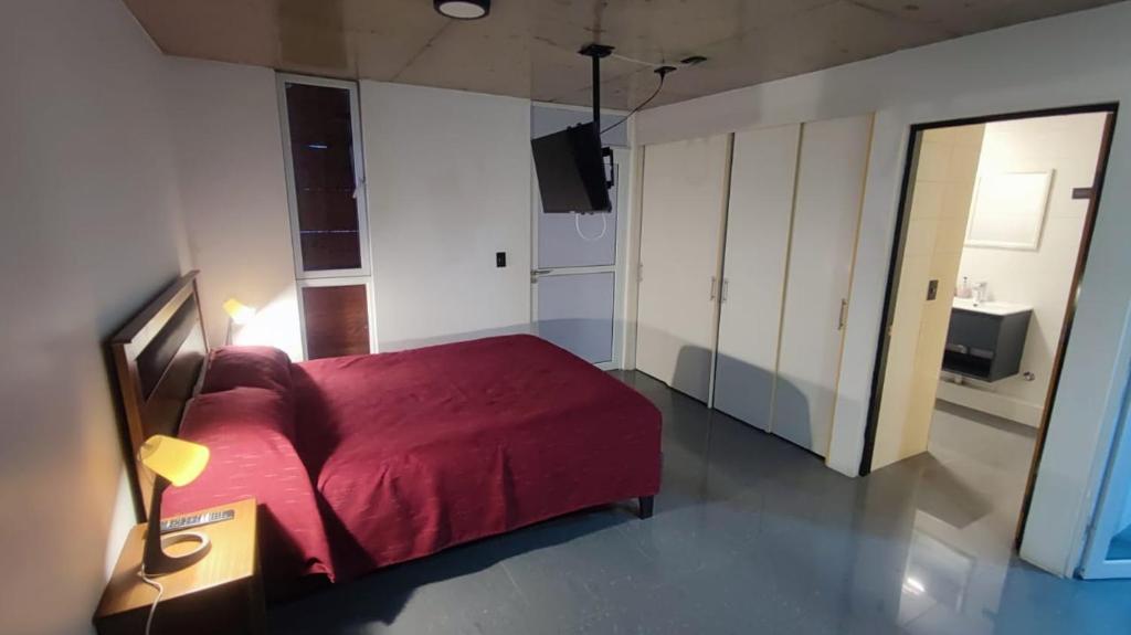 Postel nebo postele na pokoji v ubytování Puerto Enrique Apart-Hotel