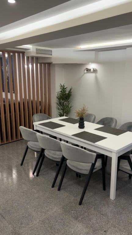 a dining room with a table and chairs at House Sela vrata in Bibinje