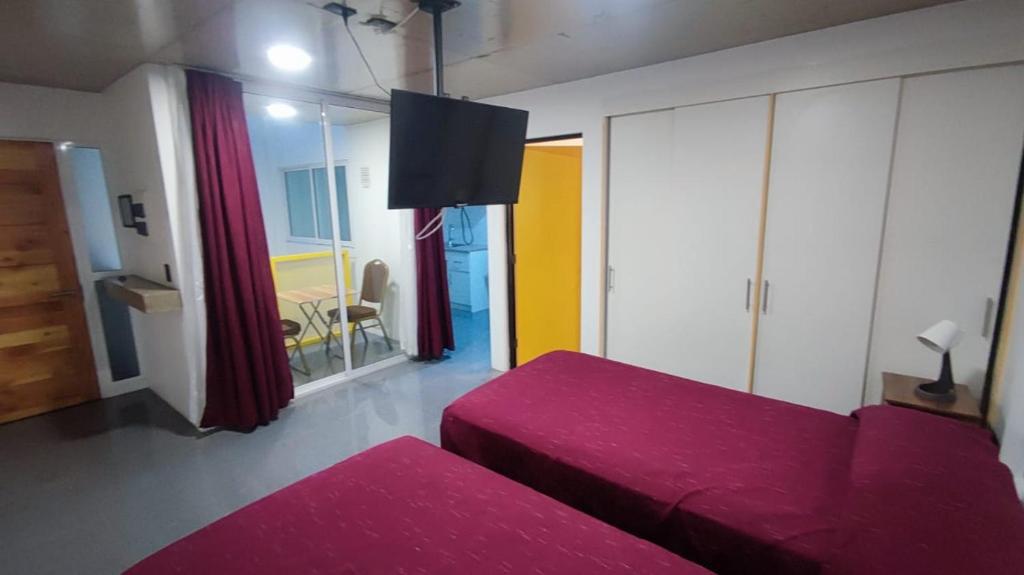 Postel nebo postele na pokoji v ubytování Puerto Enrique Apart-Hotel