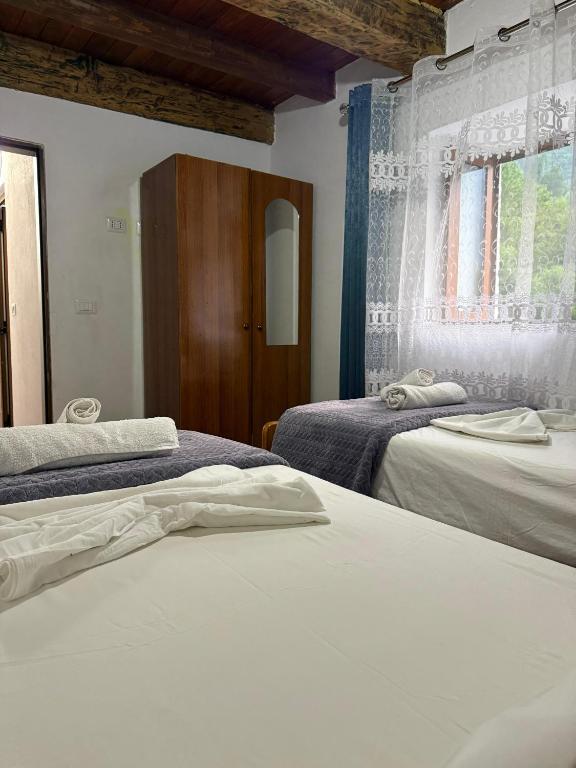 Postel nebo postele na pokoji v ubytování Guesthouse Te Tata