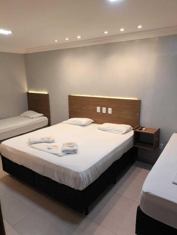 Postel nebo postele na pokoji v ubytování Hotel Luar de Itapua