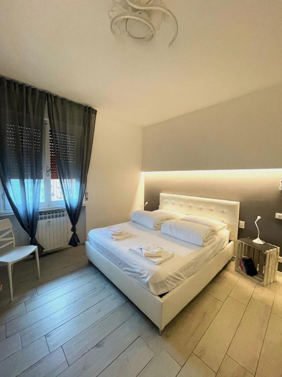 Postel nebo postele na pokoji v ubytování APPARTAMENTO BLU - Relax and Comfort 20 minutes from Florence