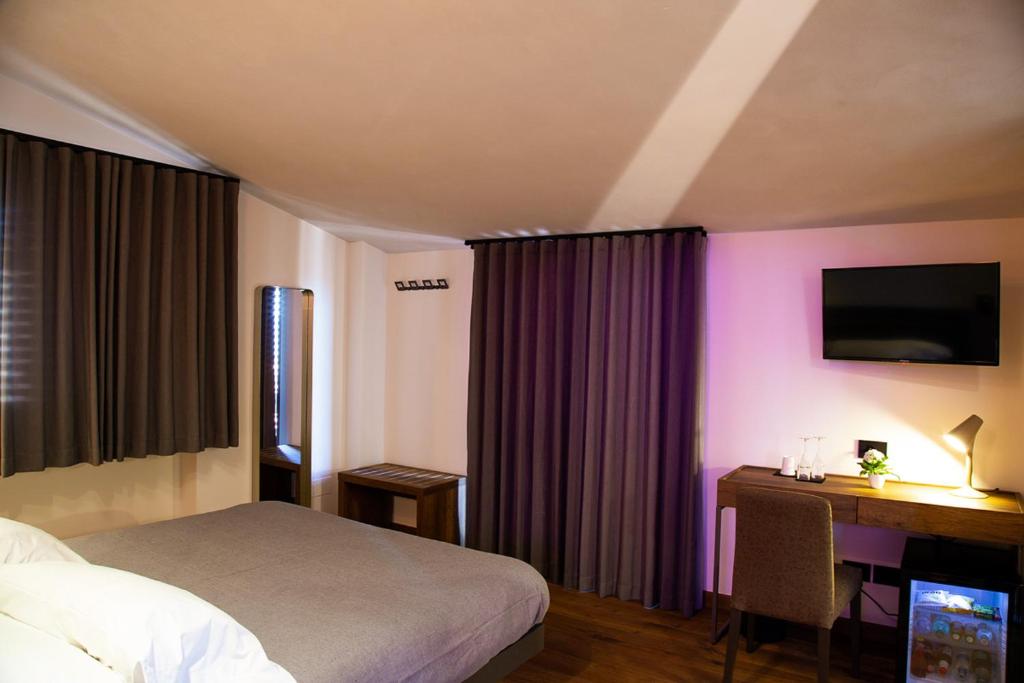 Posteľ alebo postele v izbe v ubytovaní MANTRA Suite&Rooms