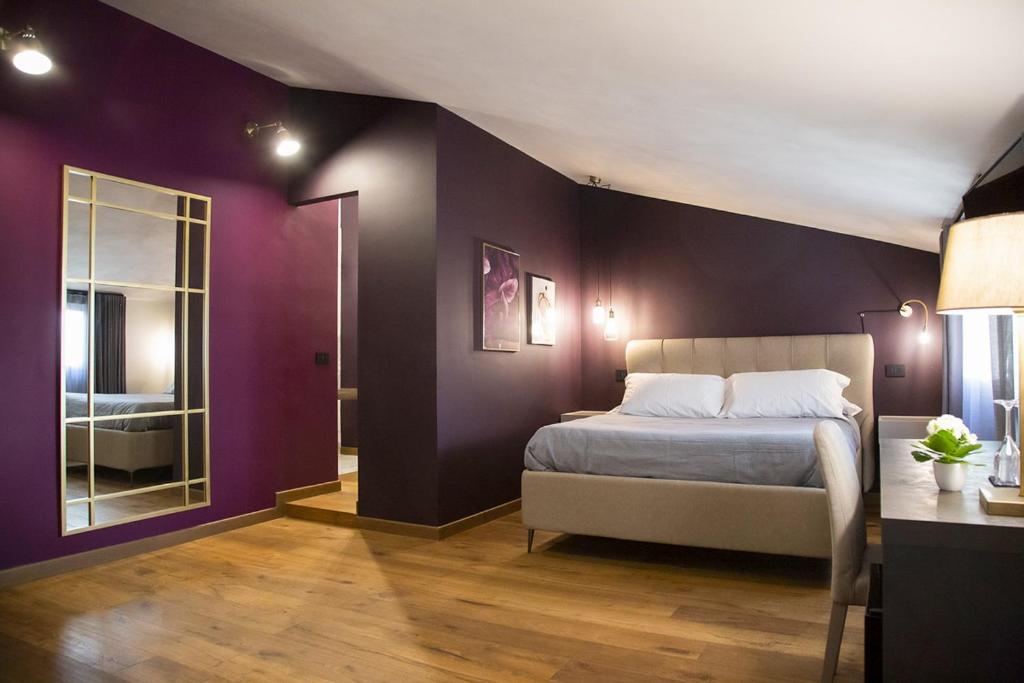Postel nebo postele na pokoji v ubytování MANTRA Suite&Rooms