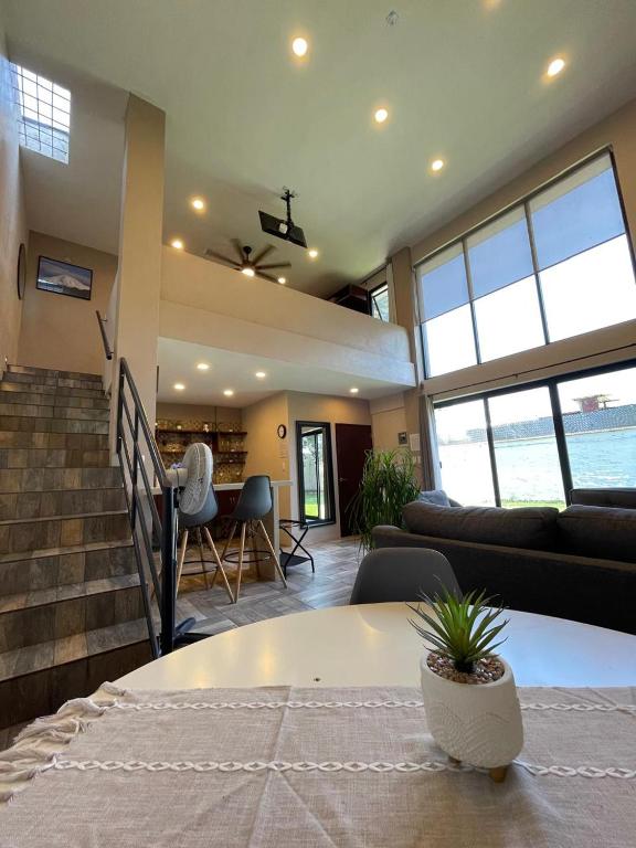 a living room with a couch and a table at Loft Sole Mio in Orizaba