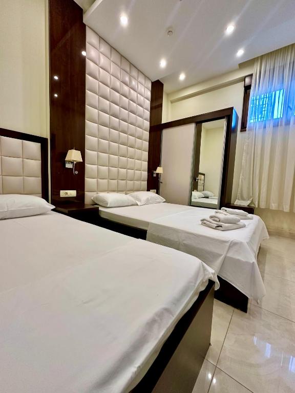 Postel nebo postele na pokoji v ubytování Shine residence