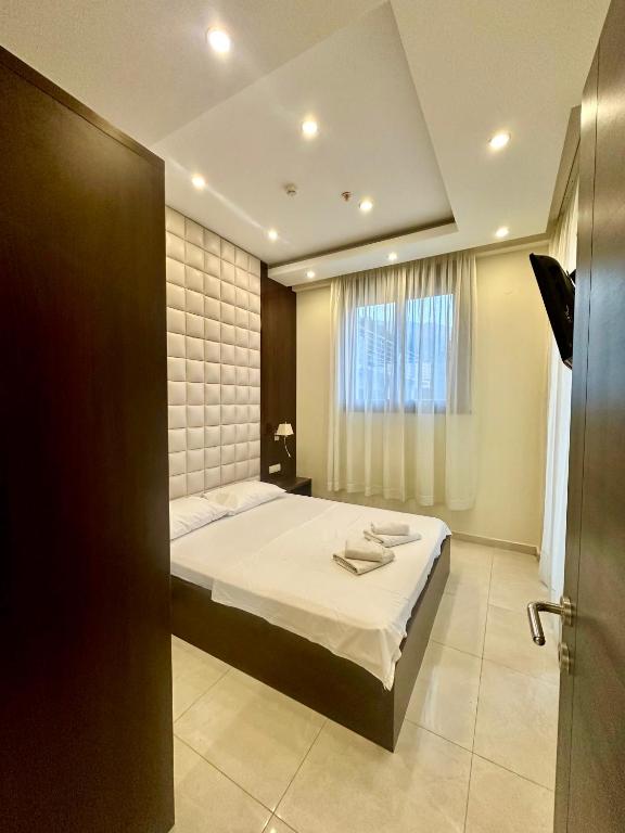 Postel nebo postele na pokoji v ubytování Shine residence
