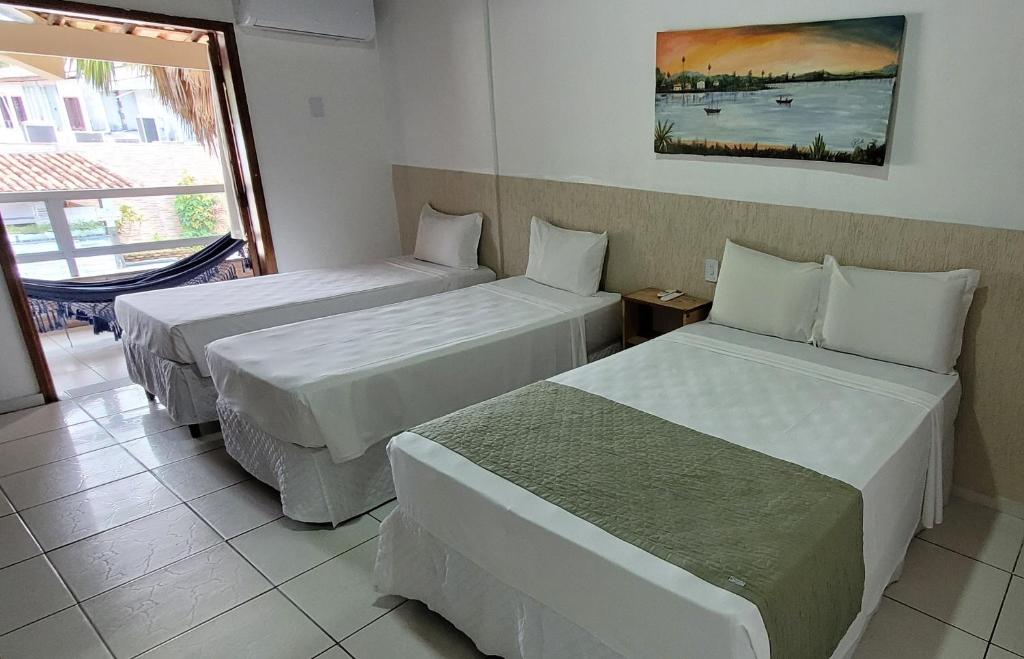 Postel nebo postele na pokoji v ubytování Hotel Malibu