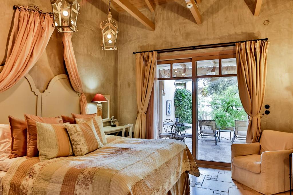 a bedroom with a large bed and a chair at Six Keys in Afissos
