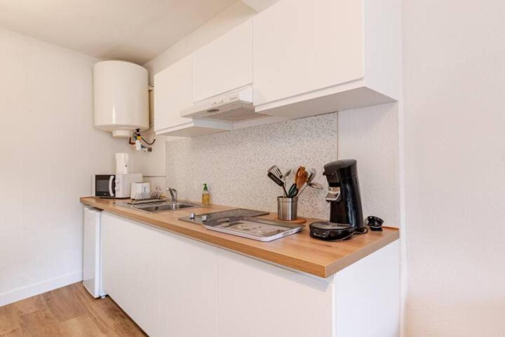 Kuchyň nebo kuchyňský kout v ubytování Appartement "Gabrielle" au calme en Hypercentre de Revel