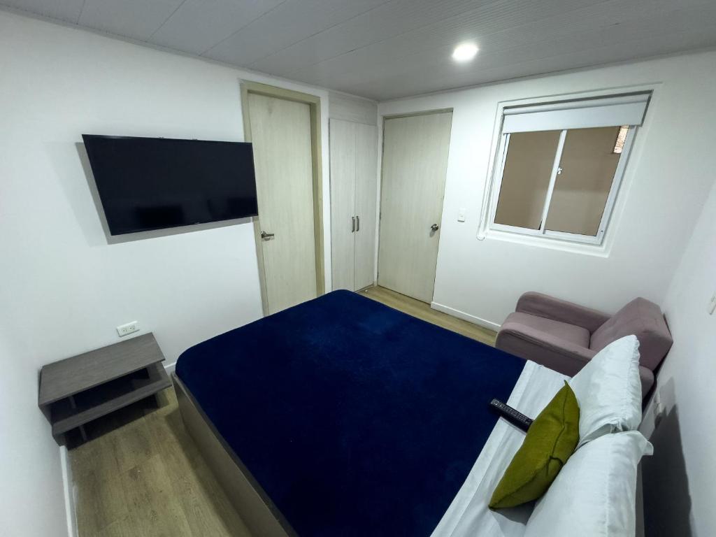 Postel nebo postele na pokoji v ubytování Hotel Feria Imperial Embajada