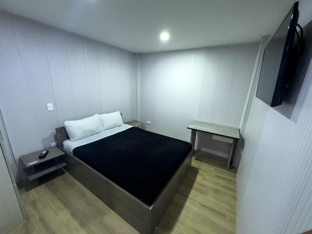 Postel nebo postele na pokoji v ubytování Hotel Feria Imperial Embajada