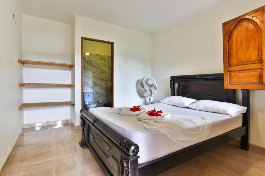 Postel nebo postele na pokoji v ubytování Hostal La Finquita