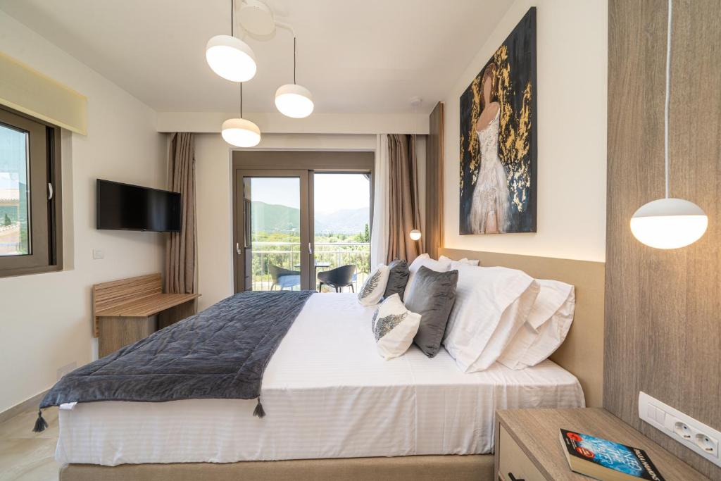 a bedroom with a large bed and a window at Maera Apartments in Sami