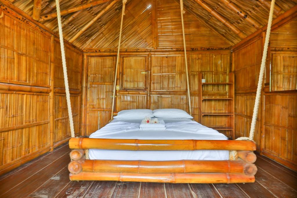 Postel nebo postele na pokoji v ubytování Hostal La Finquita