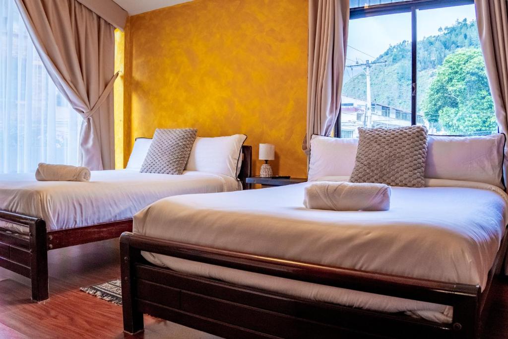 Postel nebo postele na pokoji v ubytování Hotel Casa Agave