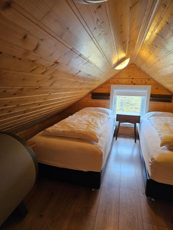 Postel nebo postele na pokoji v ubytování Starmýri 2 Cottages