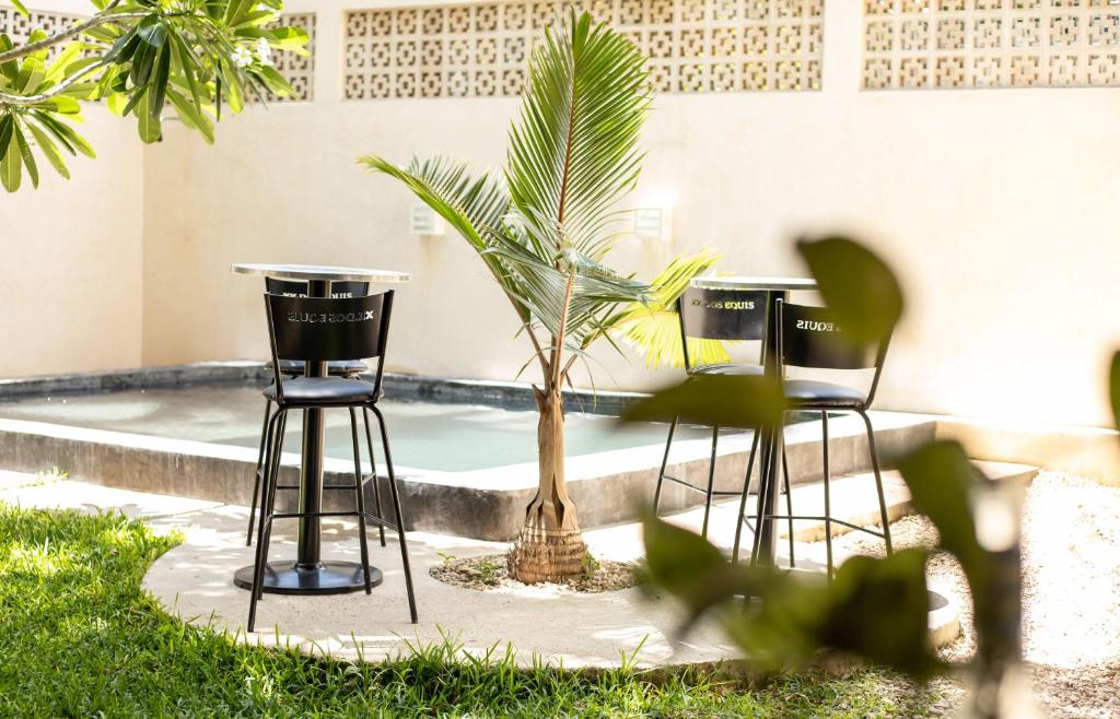 Un jardín fuera de Hostal Tunich Naj & Hotel