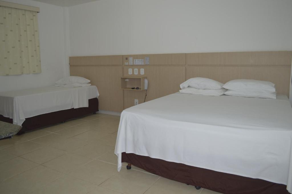 Postel nebo postele na pokoji v ubytování Richard Hotel