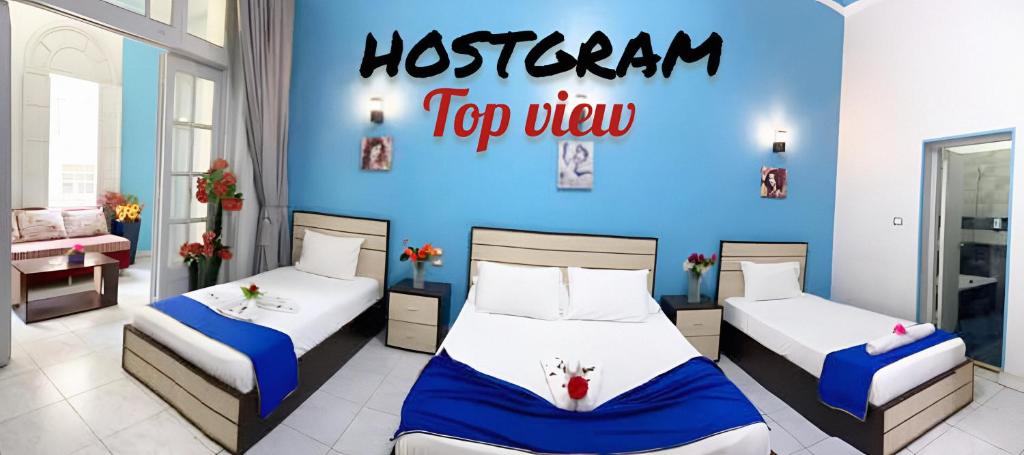 Postel nebo postele na pokoji v ubytování Hostgram Top View