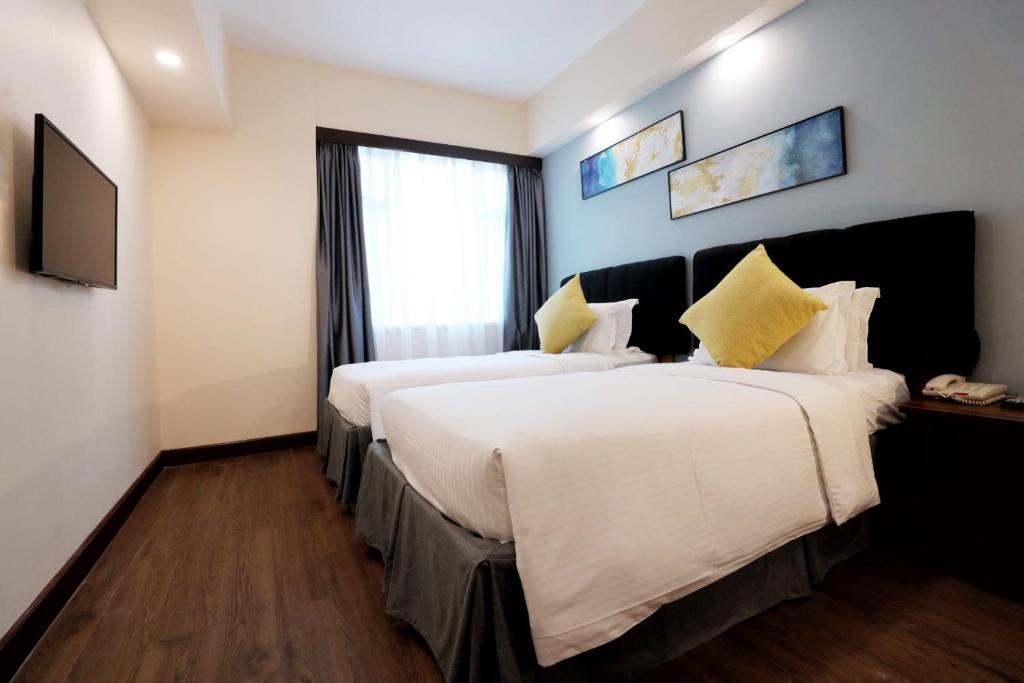 Voodi või voodid majutusasutuse The Imperial Hotel toas