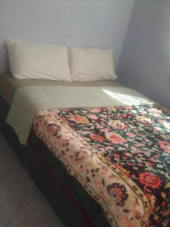Postel nebo postele na pokoji v ubytování Faigib Guest House