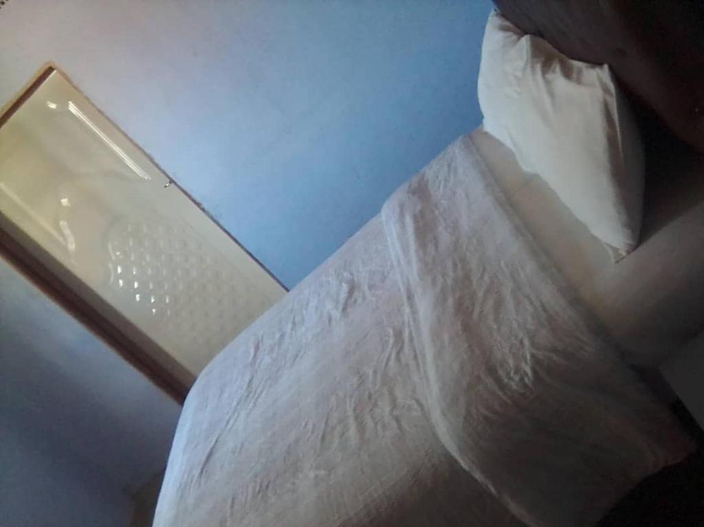 Postel nebo postele na pokoji v ubytování Faigib Guest House