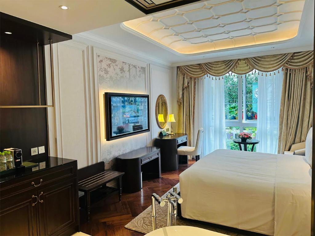 Giường trong phòng chung tại Golden Sun Hotel - Dalat