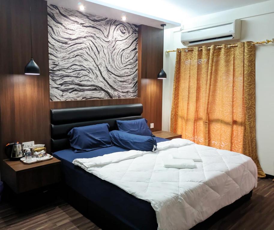 Postel nebo postele na pokoji v ubytování Nucifera Hotel Tambunan