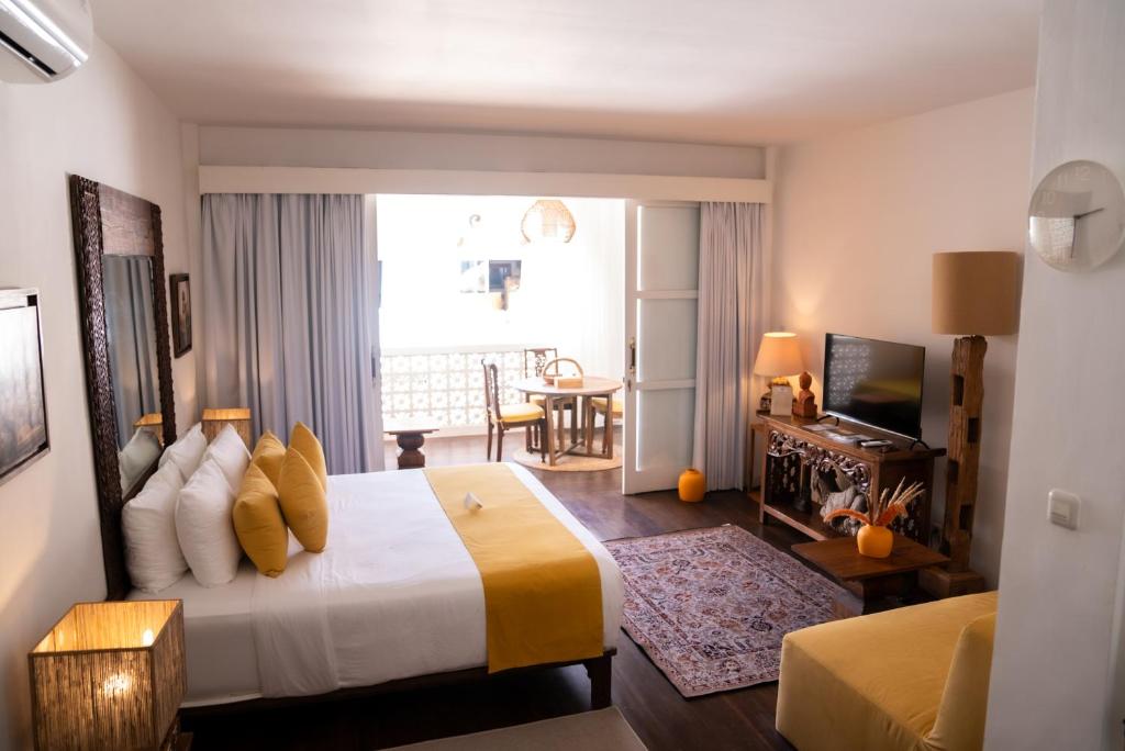 Postel nebo postele na pokoji v ubytování Antana Hotel
