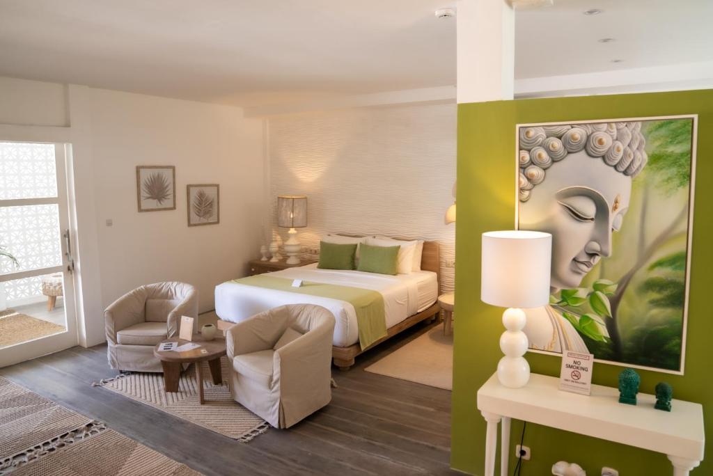 Postel nebo postele na pokoji v ubytování Antana Hotel