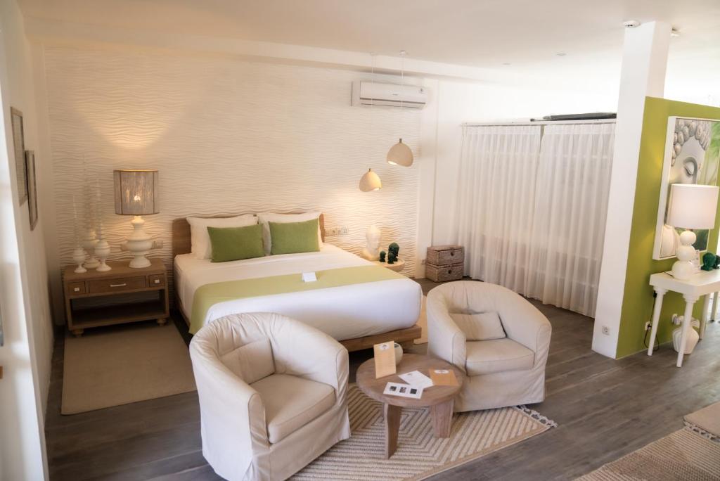 Postel nebo postele na pokoji v ubytování Antana Hotel