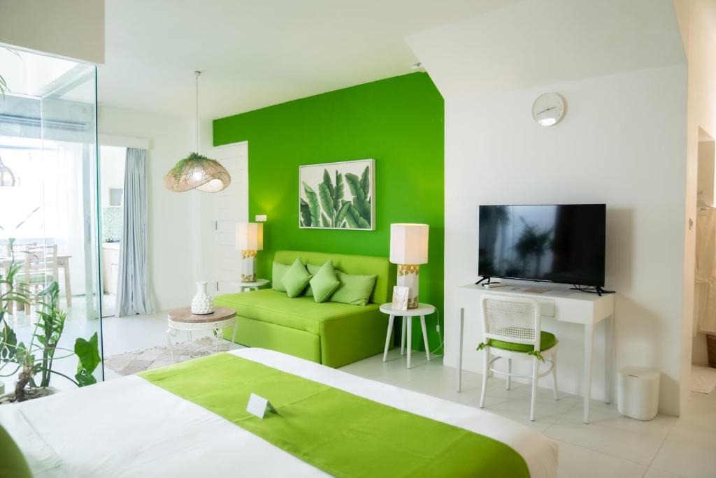 Postel nebo postele na pokoji v ubytování Antana Hotel