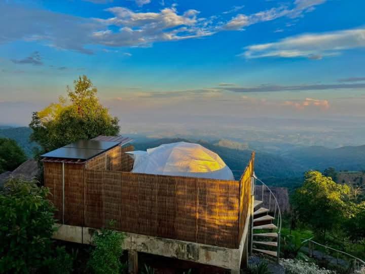a building with a dome on top of a hill at ASA Private Homestay - โดมหมีขาว in Ban San Pu Loei