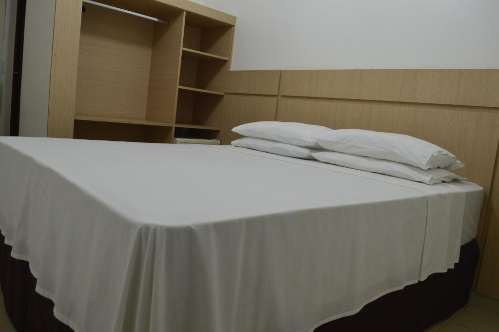 Postel nebo postele na pokoji v ubytování Richard Hotel
