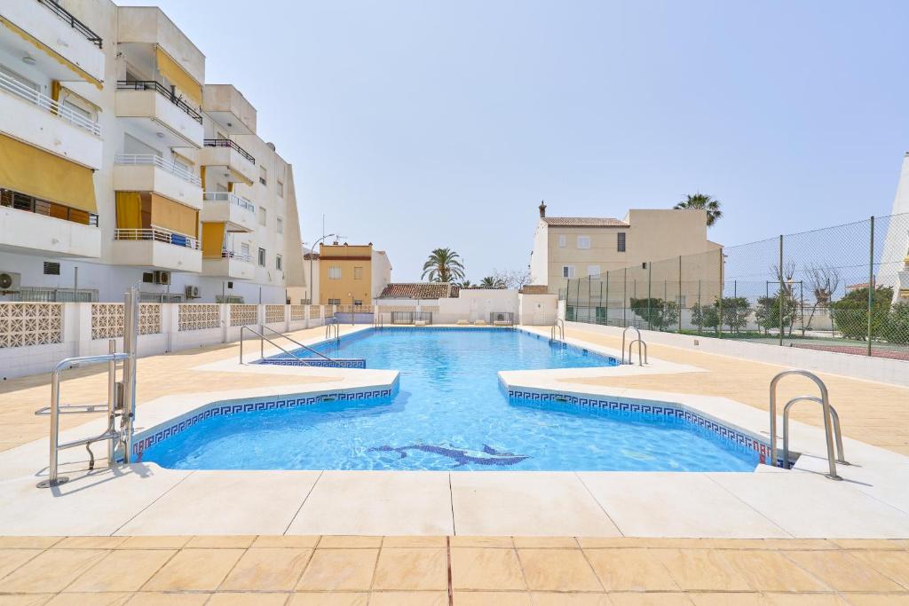 a swimming pool in the middle of a building at Beachside Bliss in Caleta De Velez