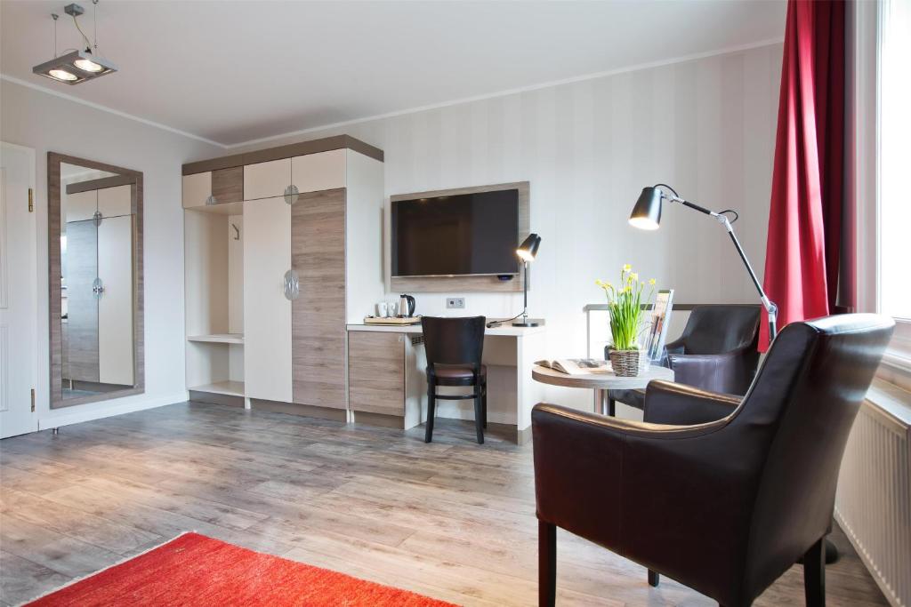 TV a/nebo společenská místnost v ubytování Best Western Plus Theodor Storm Hotel