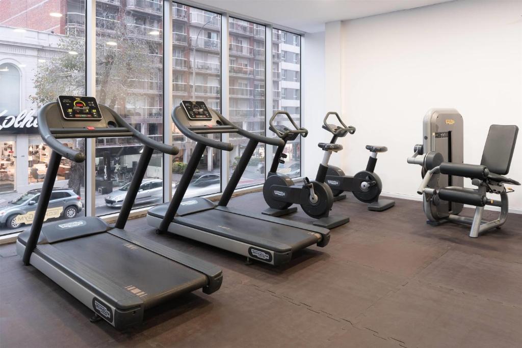 a group of treadmills and exercise bikes in a gym at Dazzler by Wyndham Montevideo in Montevideo