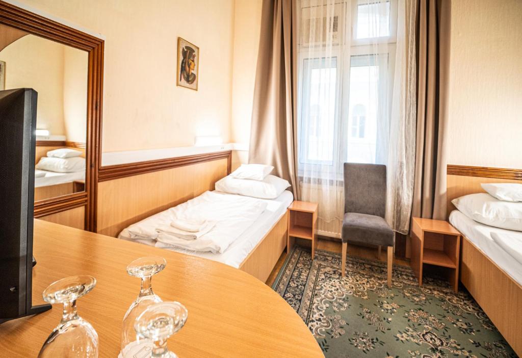 Postel nebo postele na pokoji v ubytování Tisza Hotel