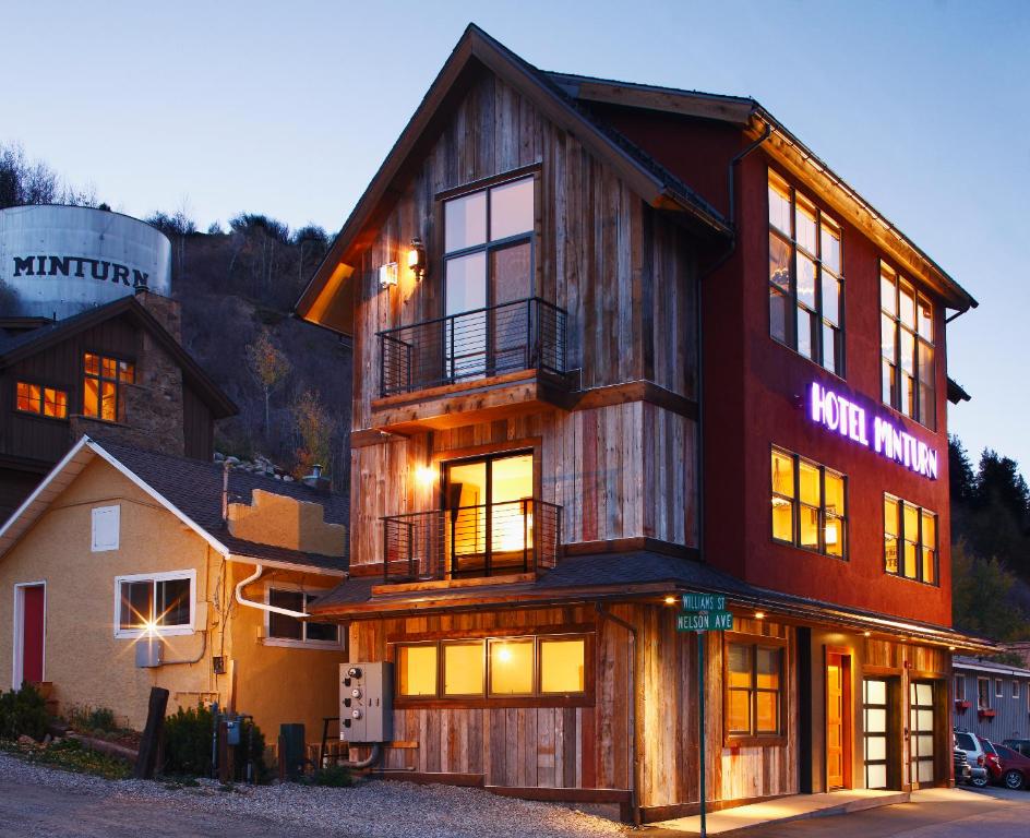 a large wooden building with a sign on it at Hotel Minturn in Minturn