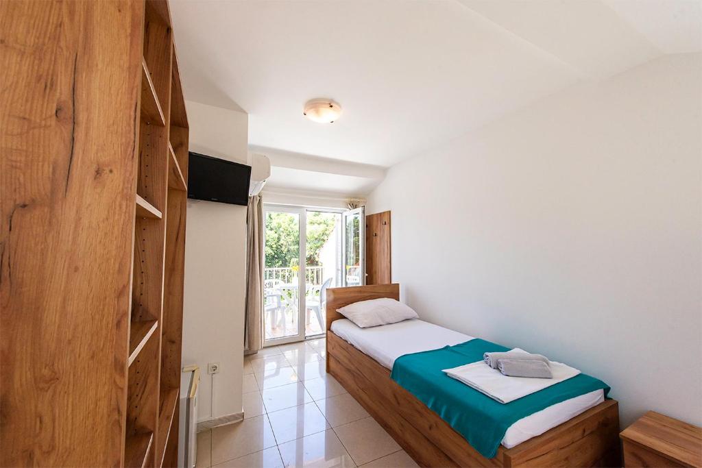 Postel nebo postele na pokoji v ubytování Villa Christina