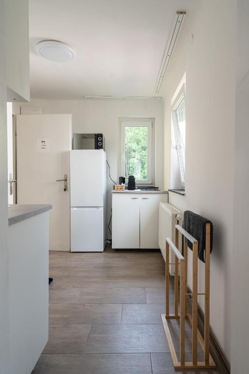 Kuchyň nebo kuchyňský kout v ubytování revLIVING Apartments Gars am Kamp