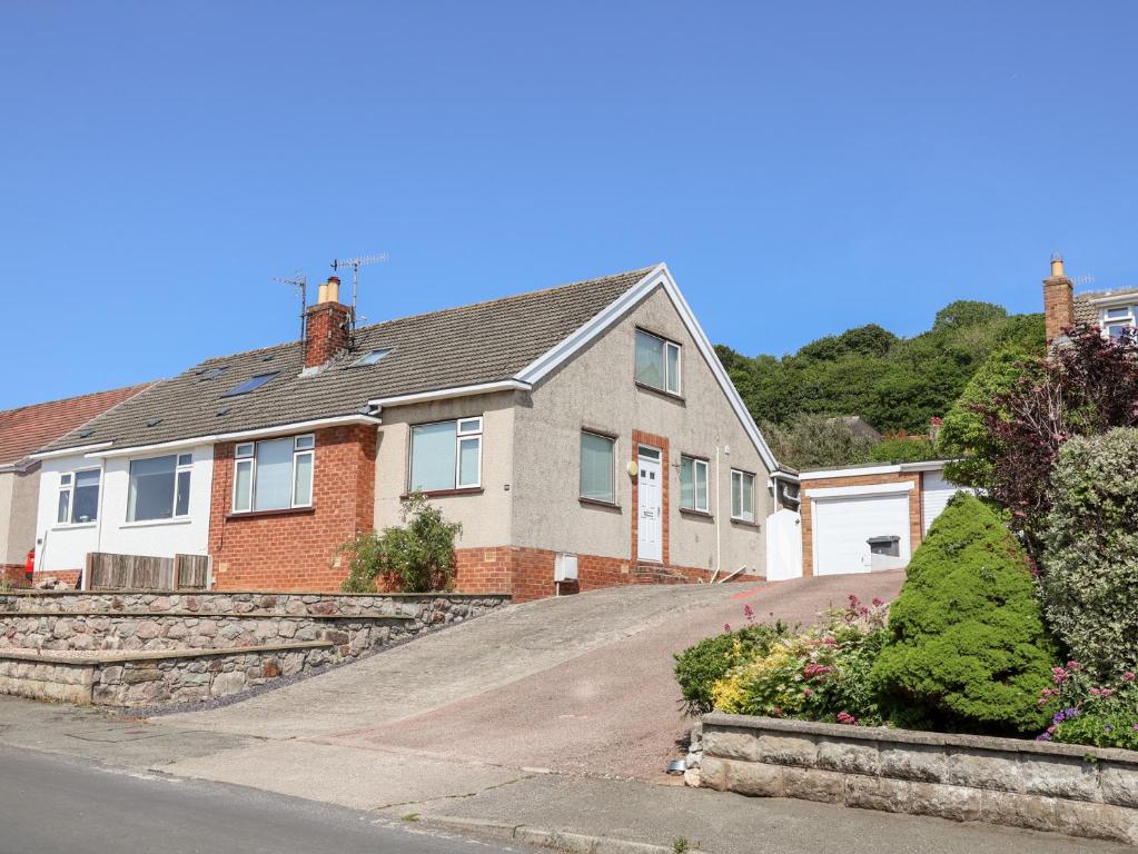 a house on the side of a road at Bryn Bach in Colwyn Bay